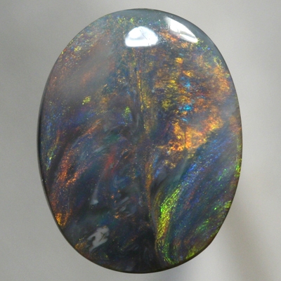 SOLID BLACK OPAL Large opal with moving orange, green and blue SEE VIDEO